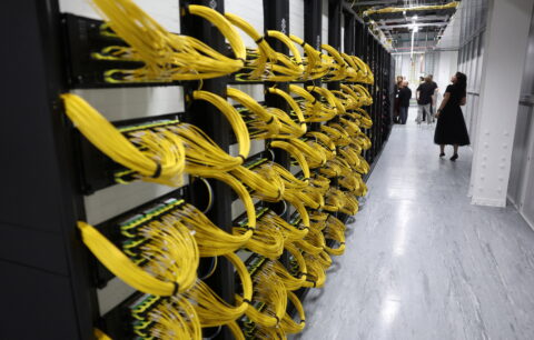 Visitors view racks for data servers, GPUs and CPUs during a tour inside the Nebius AI UK data centre, a new facility hosting NVIDIA and other computer firms, at Ark Data Centres, in Chertsey, Britain, November 6, 202