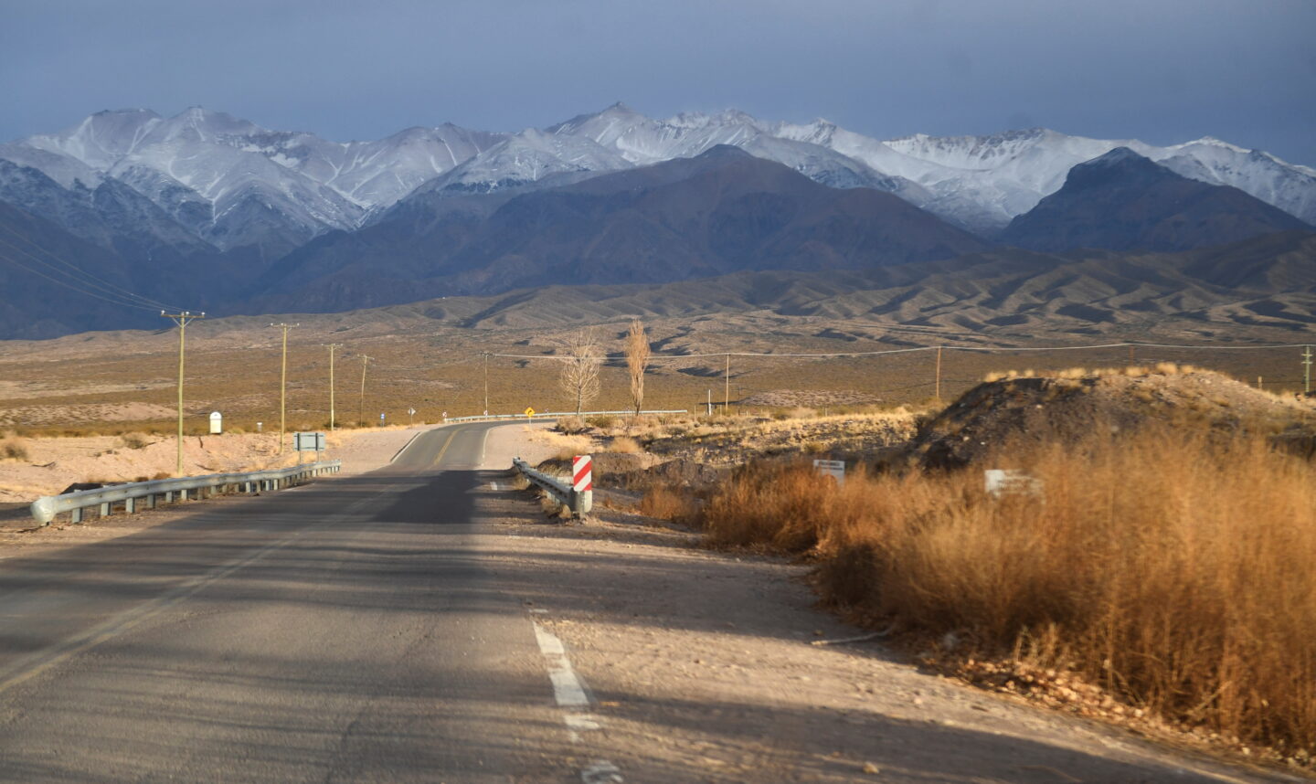 A tarmac road heading towards high glaciers in Argentina