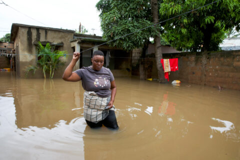 Telma Antonio, 36, stands in floodwater outside her flooded property after weeks of heavy rainfall in Maputo, Mozambique, January 21, 2026.