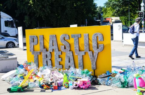 A man walks behind a public art installation by Canadian artist Benjamin Von Wong that aims to highlight the problem posed by plastic pollution ahead of the fifth resumed session of Intergovernmental Negotiating Committee 5.2 (INC5.2)