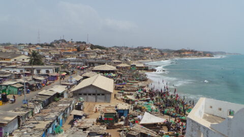 A view of Cape Coast in Ghana showing makeshift buildings and small fishing boats