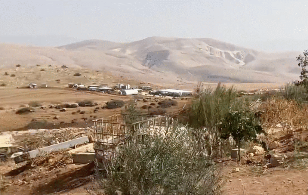 White structures amid brown hills